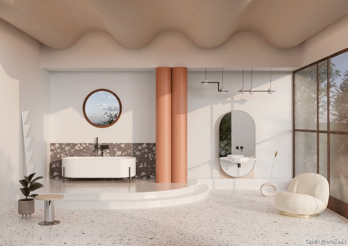 une grande salle de bains habillée de Terrazzo avec une baignoire design posée sur un piédestal